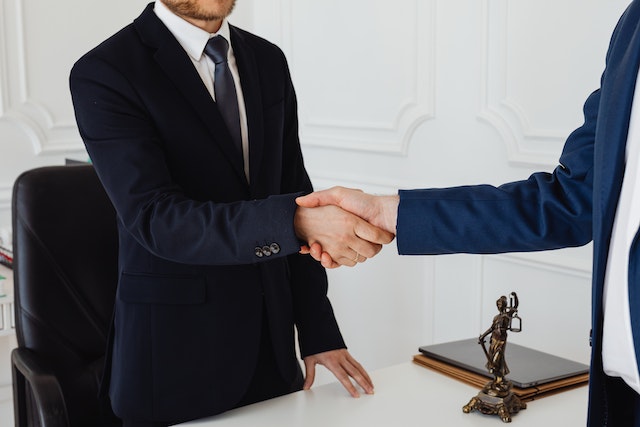 lawyer and person shaking hands